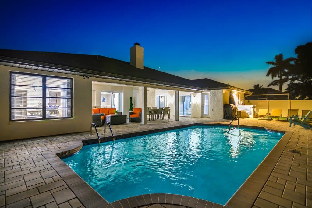 Night view of pool and patio